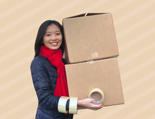 Annie Yang Holding Two Cardboard Boxes