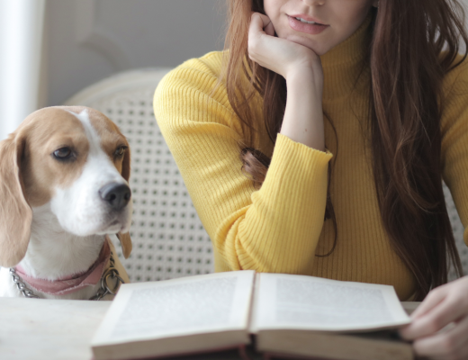 Woman With Dog Reading Book